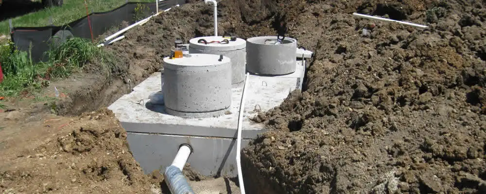 Septic system repair and installation site with tank access ports in Dallas, TX